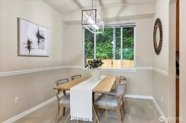 Dining Room with verdant views of the private backyard.