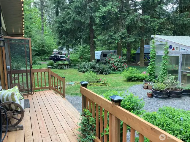 Beautiful entry to the home, stepping up onto the start of the wraparound deck
