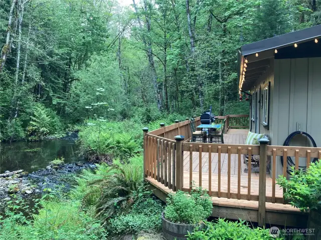 Image shows you the spaciousness of the wraparound deck that enjoys all the property has to offer