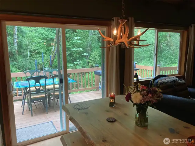 Large windows surrounding the entire home, maximizing natural light