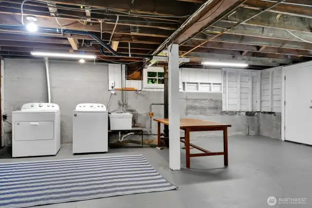 Big easy laundry area with door leading to backyard entry. Good potential to make this basement more living space.