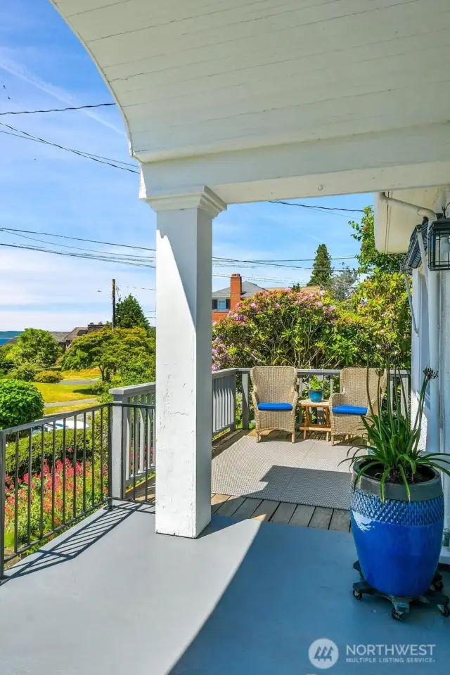 Front porch with arched beadbord detail and deck extension. Your own front row seat to fabulous summer sunsets.