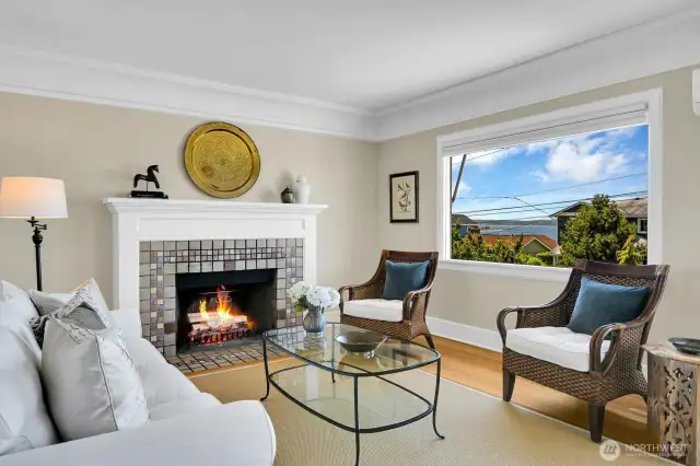 Grand coffered ceilings, original trim & hardwoods in the generous living room & dining room.