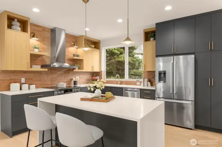 Cooking and dining come together with an island built for brunch spreads and homework sessions. Under cabinet lighting brightens every task.