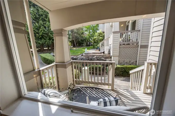 Covered front porch to sit and relax!