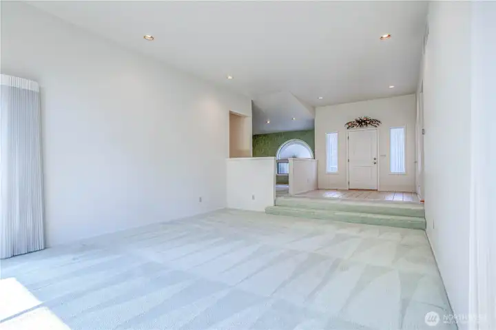 Living room view to entry and dining room