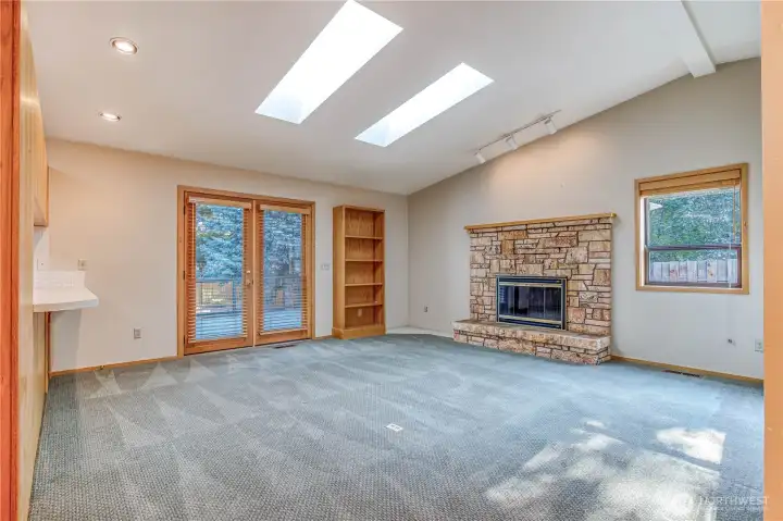Family room fireplace. Real wood French doors