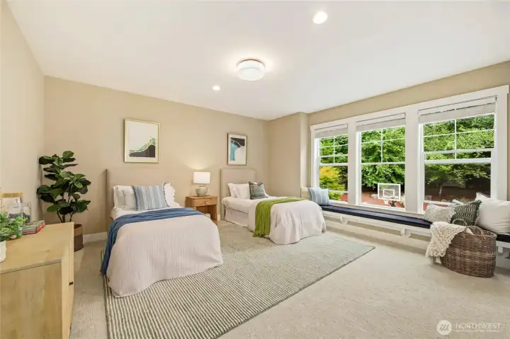 Large secondary ensuite bedroom overlooking backyard.