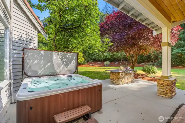 Relax & entertain year-round on inviting covered patio featuring cozy fireplace, private jacuzzi retreat, built-in grill.