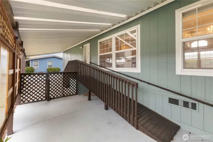 Ramp or stairs to main door leads into kitchen and utility room