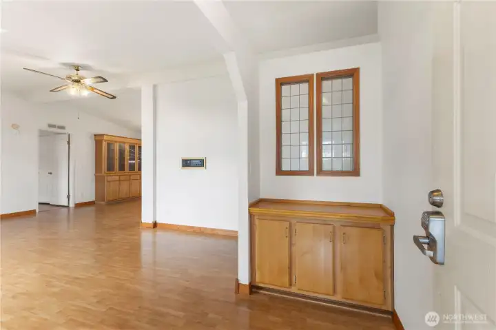 Front door off sunroom opens to the living room