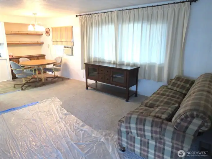 Living room with kitchen eating area