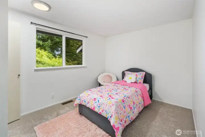 Upstairs bedroom with one window.