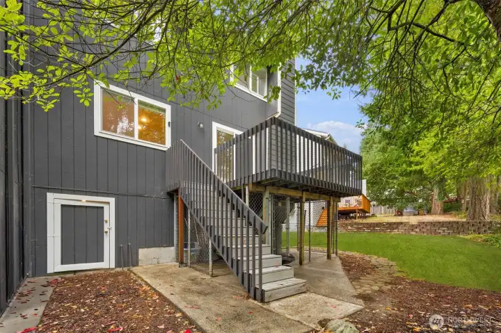Back of townhome. Door access to the crawl space.