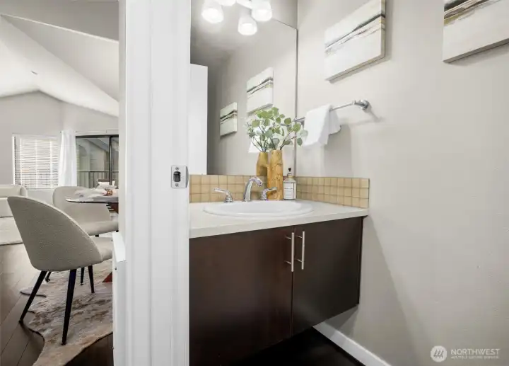 There is a 1/2 bath on the top floor (there is a bathroom on each level of the home).