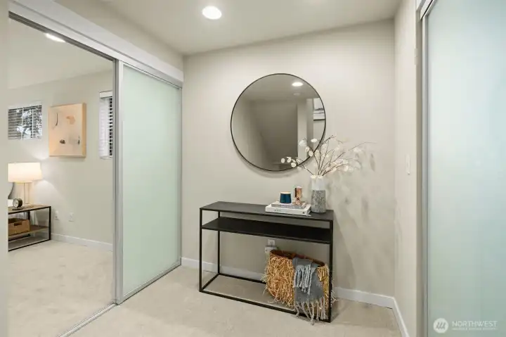 Second floor landing with the Primary to the left and the second bedroom to the right.