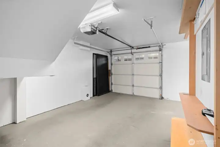 The attached one-car garage provides everyday convenience with storage you cannot see here to the left and to the right in the photo.