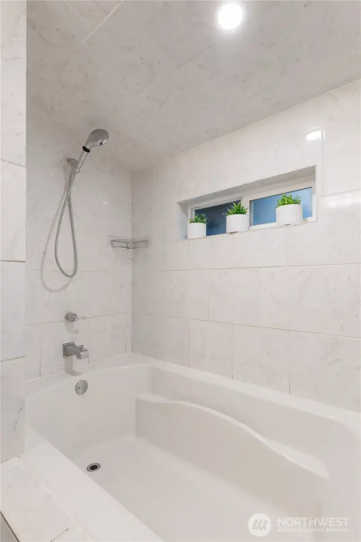 Great soaking tub and shower, fully tiled.