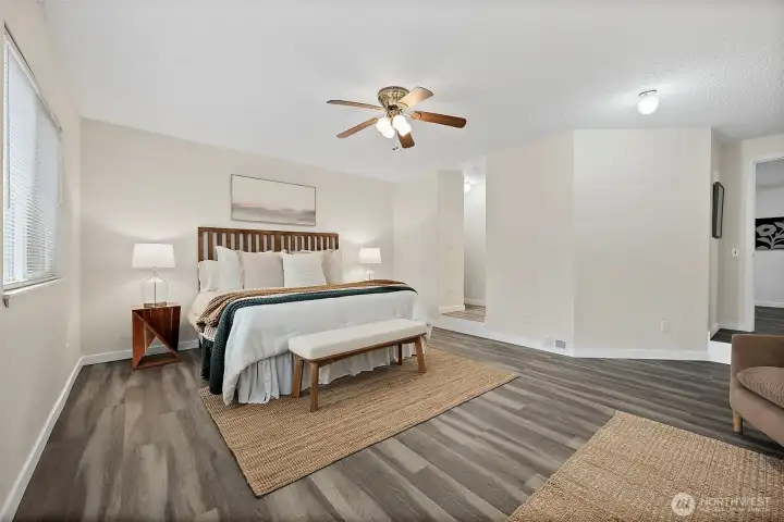 Cozy primary with step down from main hallway (converted from a garage), and set up into the closet and en-euite bathroom.