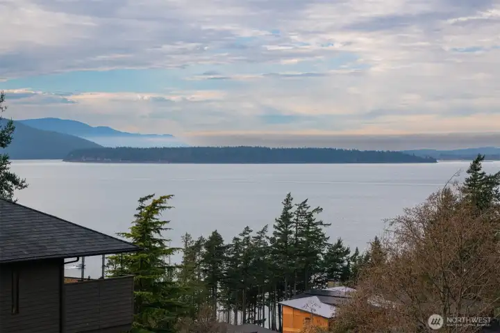 The stunning salt water views from the front of the home off the deck, with the Olympic Mountains beyond the San Juan Islands.