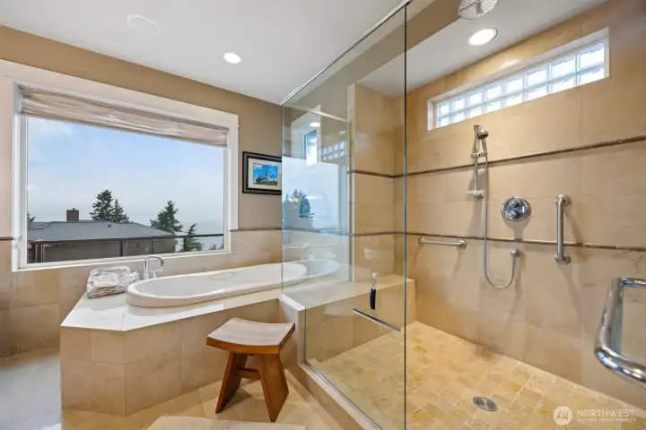 Another view of the oversized shower and the deep soaking tub that are all tiled in travertine.