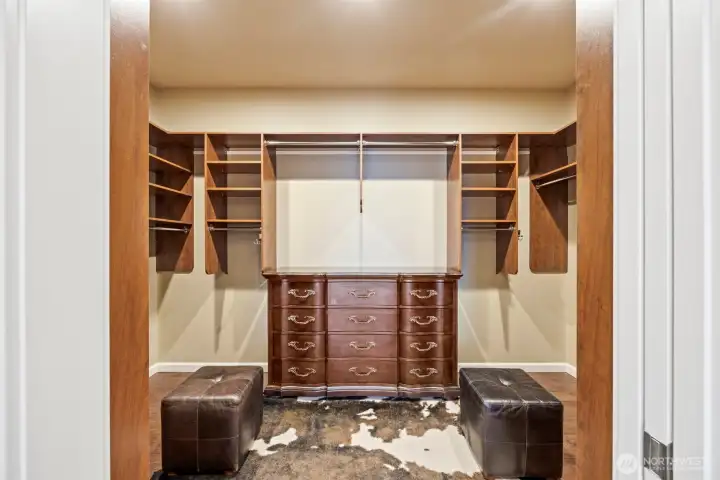 The walk-in closet at the primary suite is also spacious and has built-ins and room for an additional dresser.