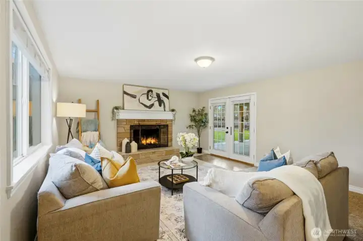 The open flow allows the family room to remain connected to the rest of the home while still feeling like its own comfortable escape. A huge covered patio waits just beyond the doors.