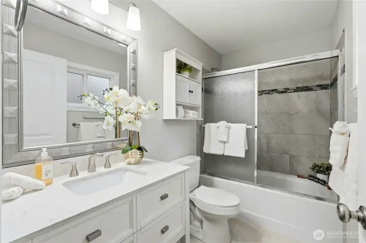The accompanying primary bathroom features updated finishes that reflect the quality of the home’s renovation. Altogether, the suite creates a peaceful retreat at the end of each day.