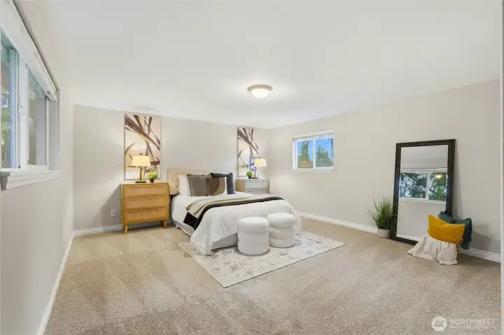 Two additional bedrooms offer flexibility for a variety of living needs. These rooms are spacious enough to comfortably accommodate guests, home office setups, or growing households.