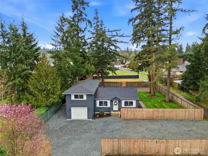 Set on more than half an acre of flat, usable land, the property offers exceptional outdoor potential.