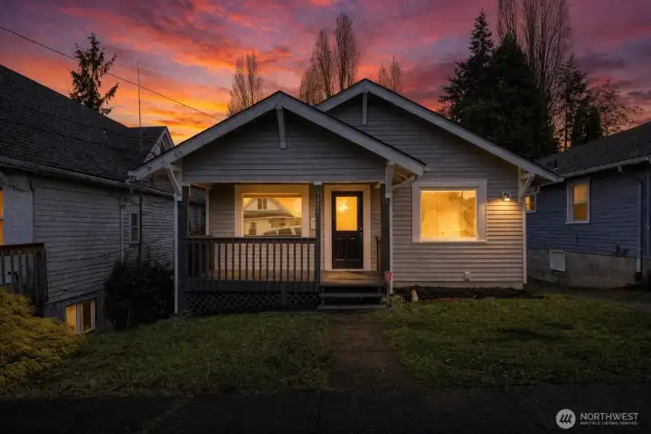 Front of home with covered and inviting porch.