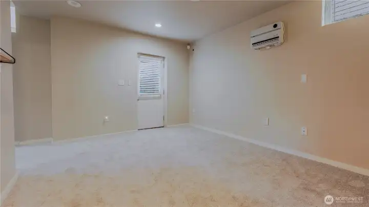 Flex room with additional back entrance for potential rental option.
