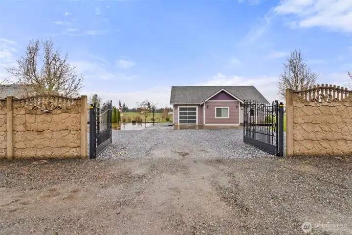 Custom wall with double gate entrance to property.