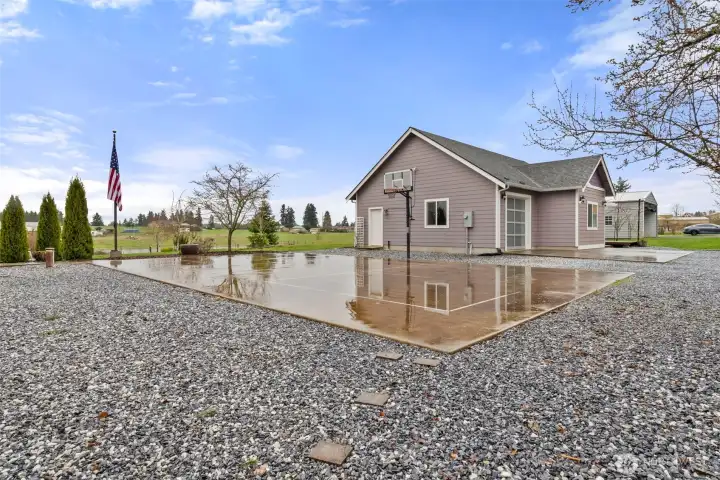 Outdoor sport court & detached garage with finsihed apartment.