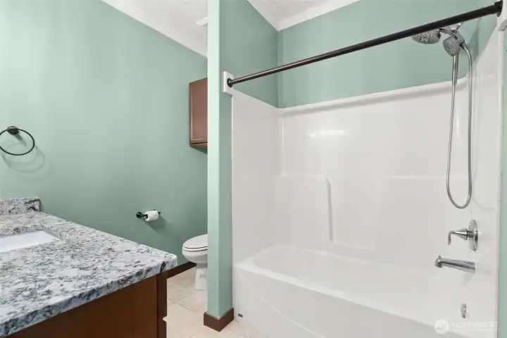 Guest bath with tub and shower.