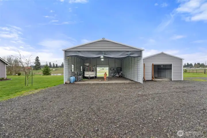 Covered RV storage with sewage hookup and 220amp.