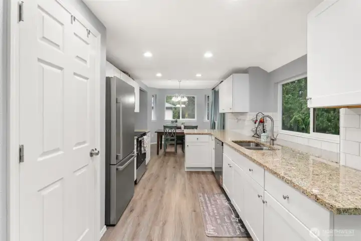 In the kitchen you will find updated counter tops and cabinets, stainless steel pantry and a window overlooking the nature outside!