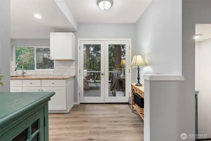 Enjoy french doors leading to your patio in the trees!