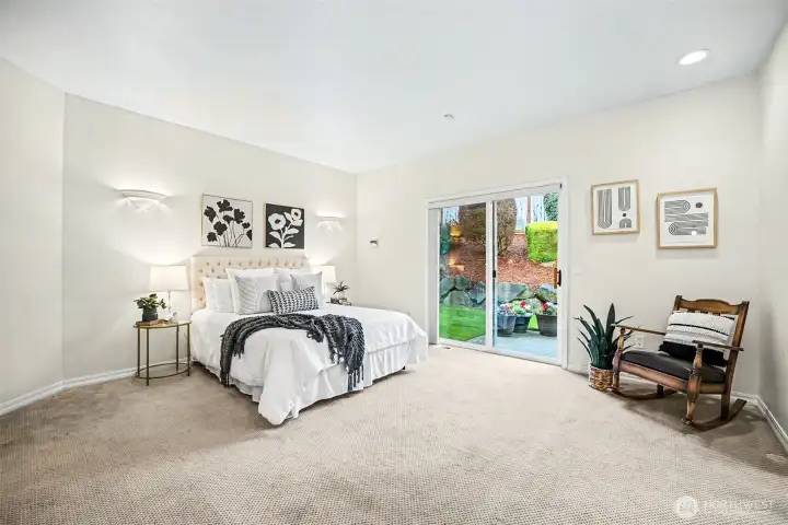 Primary bedroom with private spa-like bathroom and two walk-in closets.