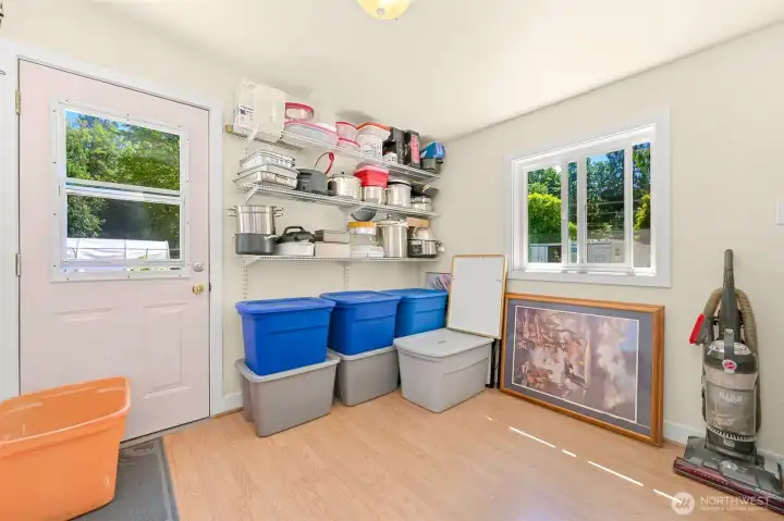 Versatile second bedroom ideal for guests, office, or additional storage, with built-in shelving and natural light.