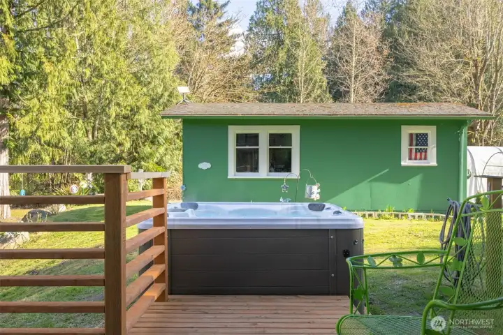 A detached outbuilding offers flexible use as a shop, studio, or additional space