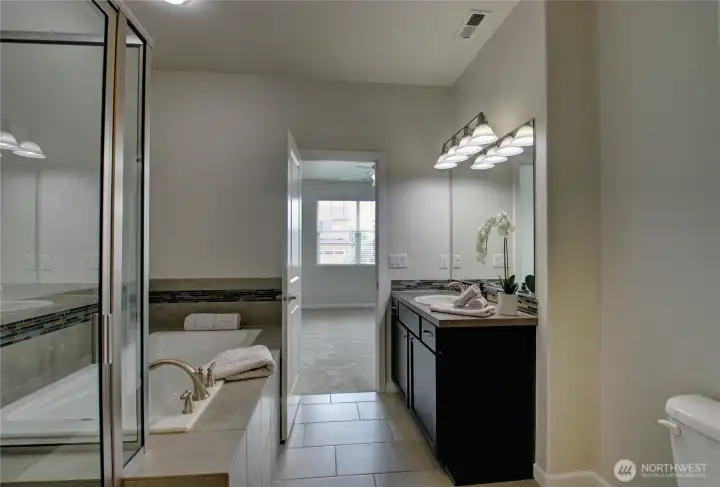 Looking from closet into bathroom and beroom.