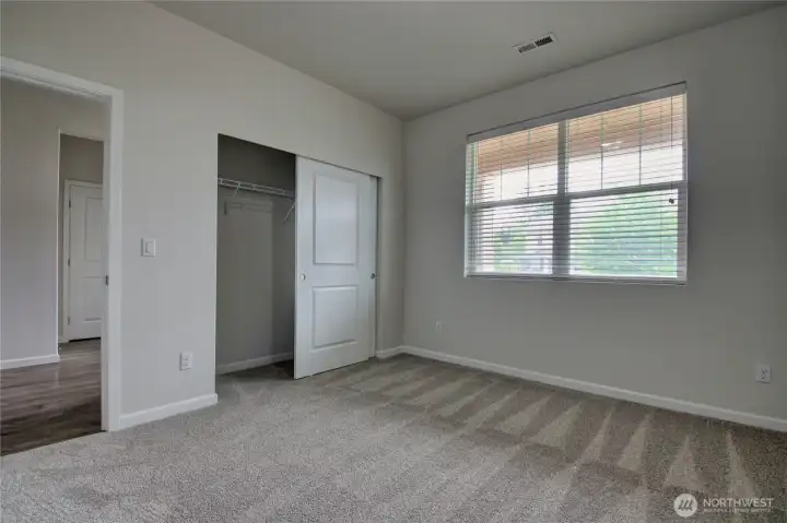 2nd bedroom looking towards closet and hallway.