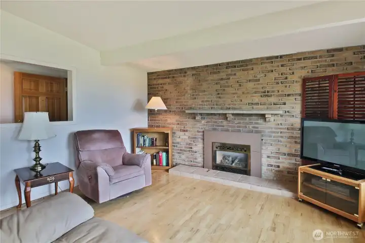 The living room with a cozy fireplace invites relaxation. The living room with a cozy fireplace invites relaxation.