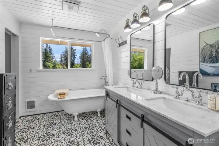 Tongue and groove walls allow you to relax in the claw tub after a long day Tongue and groove walls allow you to relax in the claw tub after a long day
