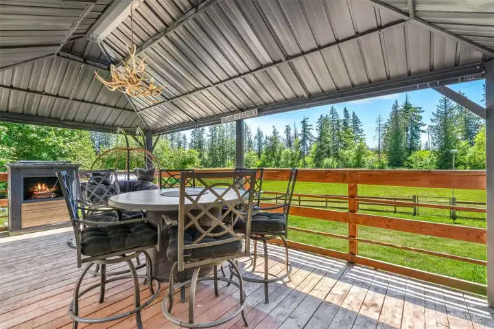 Covered back patio to stay in the shade or out of the rain Covered back patio to stay in the shade or out of the rain
