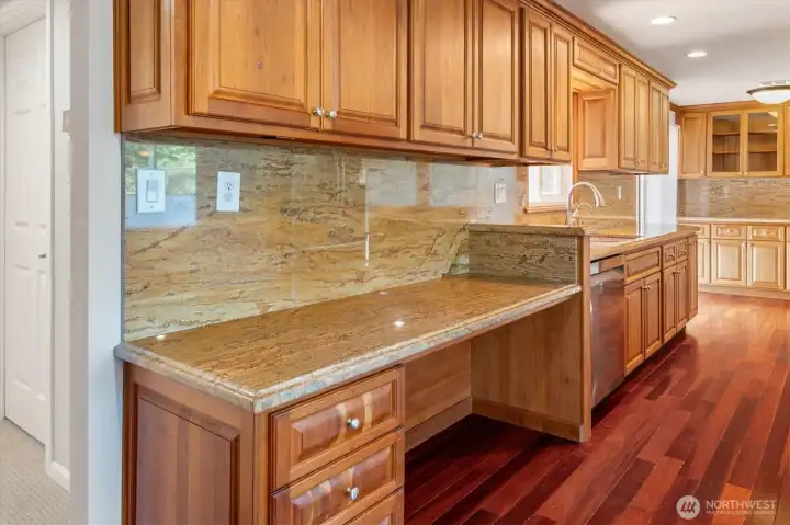 Built-in desk/mail center on far left side of kitchen.