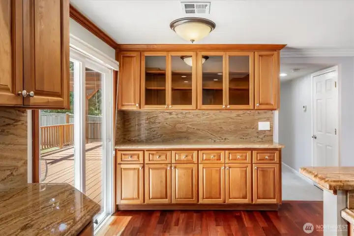 Plenty of cabinetry storage just off the right side of the kitchen.
