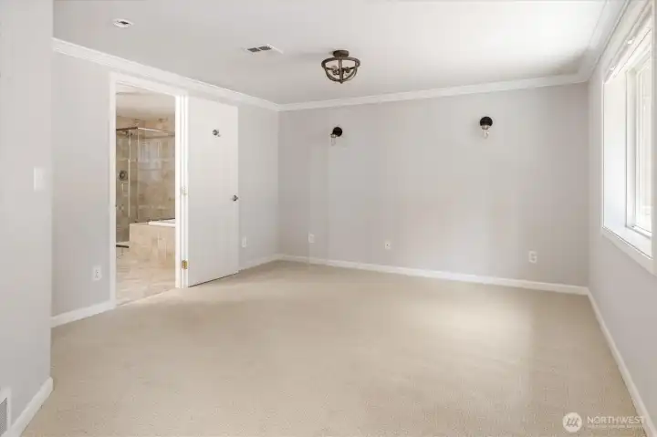View of primary suite without staging.
