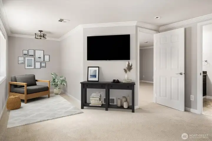 Additional alcove located within the primary suite, currently virtually staged as a reading nook.